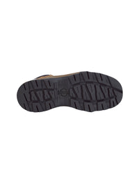 A top-down view of a shoe's black treaded outsole, showing a textured pattern and a small embossed logo in the center, set against a plain white background.