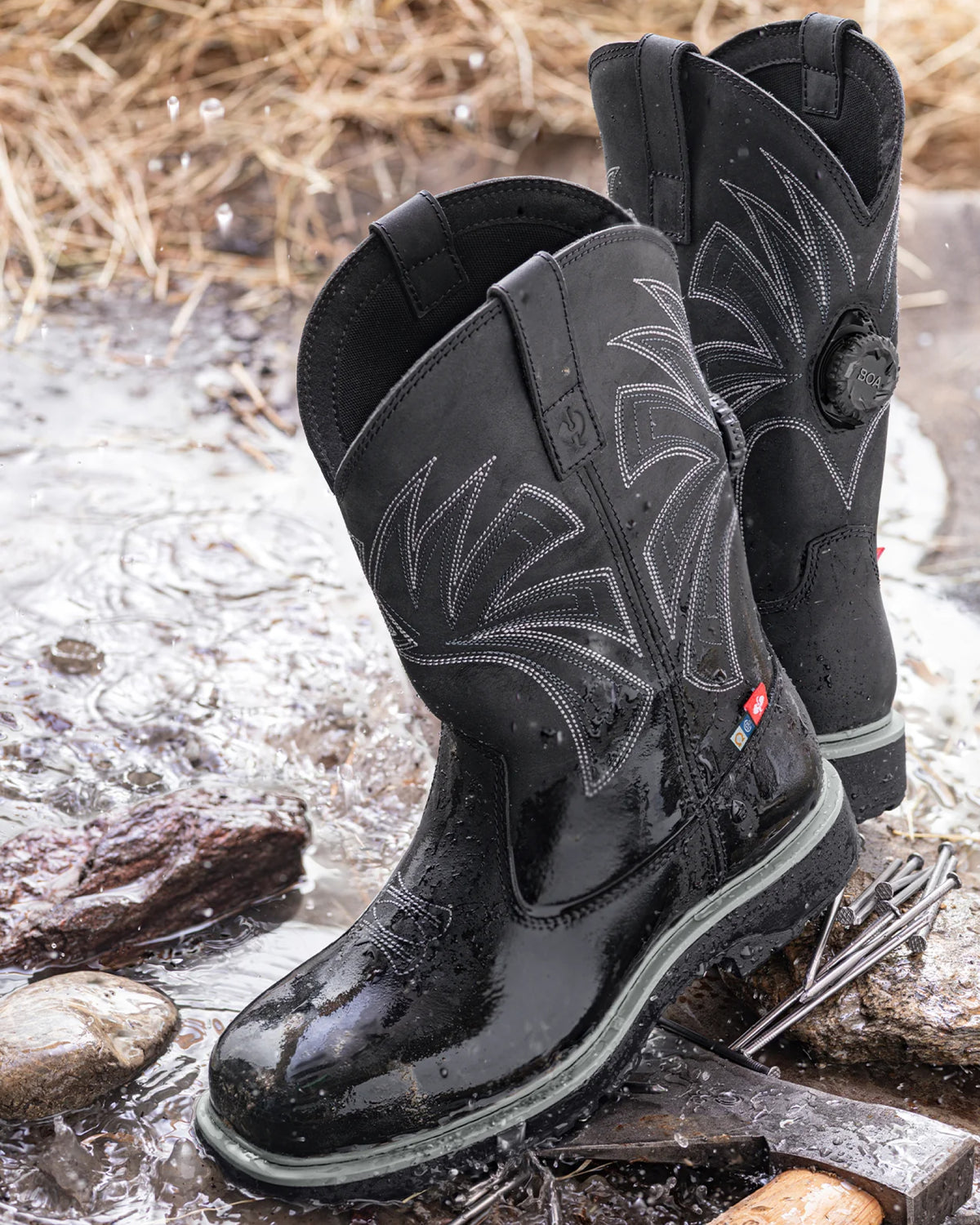 STRAUSS Doonan 12-inch Composite Toe Work Boot in Black worn in an outdoor work setting