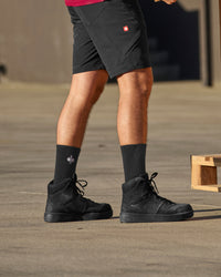 STRAUSS Eindhoven 6-inch Steel Toe Work Boot in Black shown on rough jobsite ground
