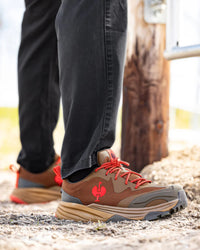 STRAUSS Harlem Composite Toe Work Shoe in Desert brown shown on rough jobsite ground
