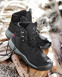 STRAUSS Queenstown 6-inch Steel Toe Work Boot in Black shown on rough jobsite ground