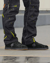 STRAUSS Tampa Steel Toe Work Shoe in Black shown on rough jobsite ground