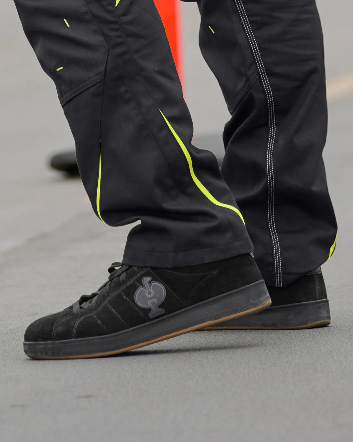 STRAUSS Tampa Steel Toe Work Shoe in Black worn in an outdoor work setting