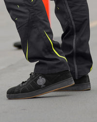 STRAUSS Tampa Steel Toe Work Shoe in Black worn in an outdoor work setting