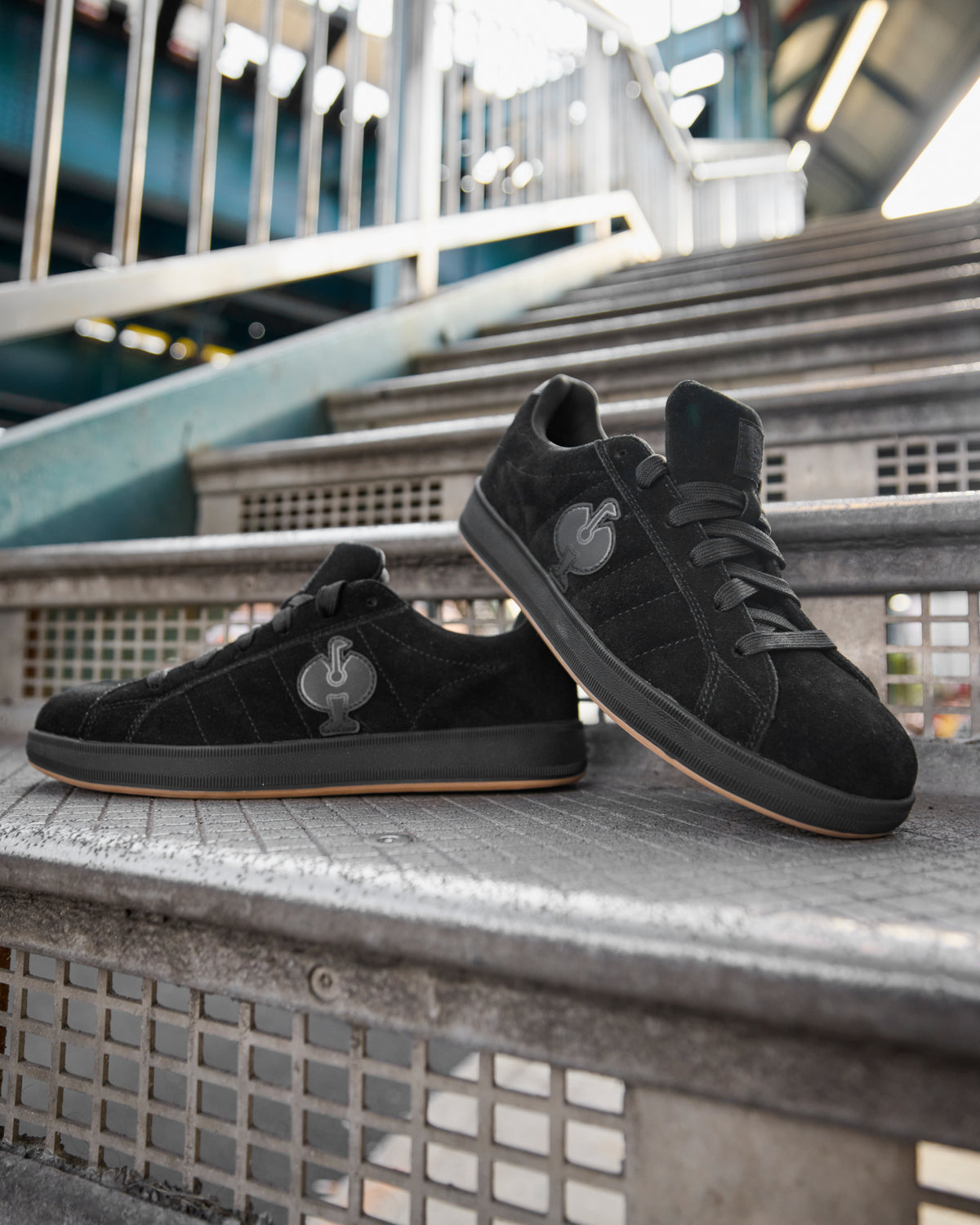 STRAUSS Tampa Steel Toe Work Shoe in Black with workwear in a jobsite scene