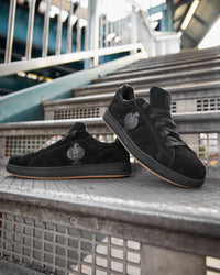 STRAUSS Tampa Steel Toe Work Shoe in Black with workwear in a jobsite scene