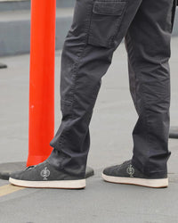 STRAUSS Tampa Steel Toe Work Shoe in Carbon gray worn in an outdoor work setting