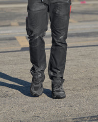 STRAUSS St. Louis Composite Toe Work Shoe in Carbon gray shown on rough jobsite ground
