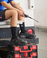 STRAUSS St. Louis Composite Toe Work Shoe in Black worn in an outdoor work setting