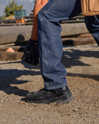 STRAUSS St. Louis Composite Toe Work Shoe in Black with workwear in a jobsite scene