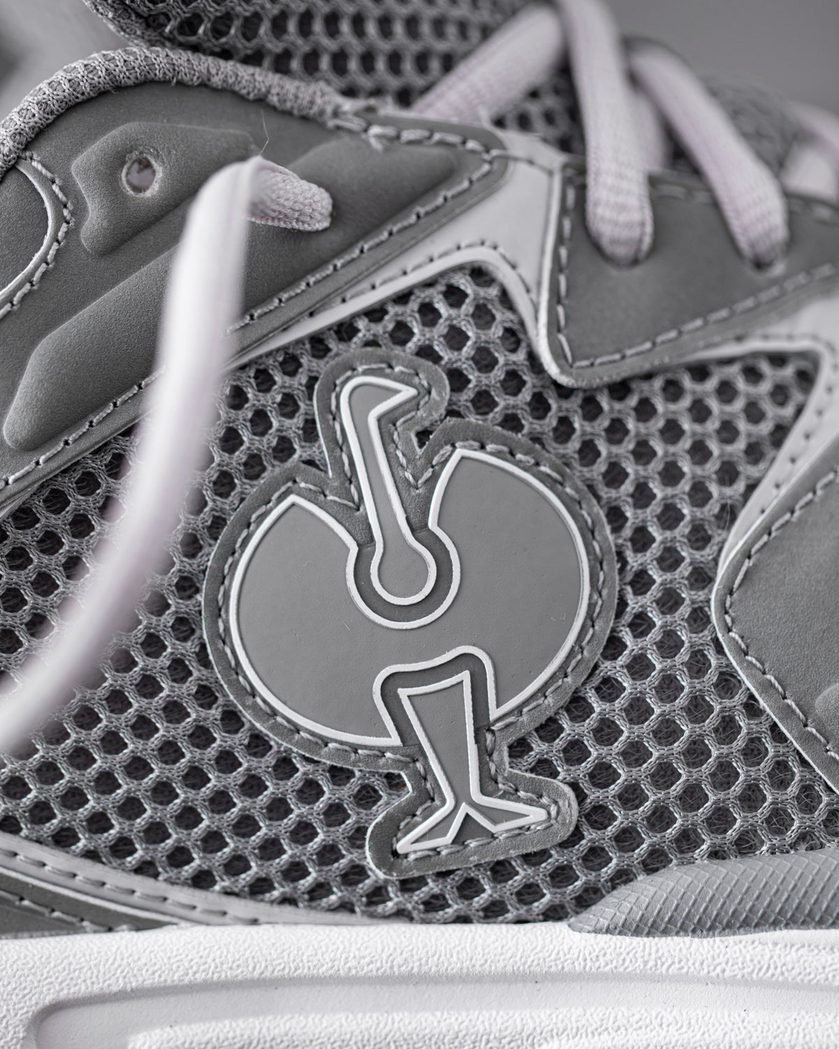 Close-up of the Pearl gray St. Louis Composite Toe Work Shoe Strauss Logo