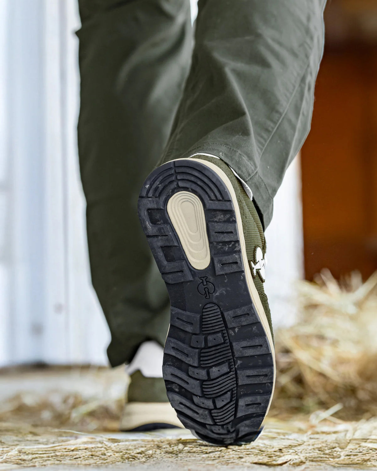 STRAUSS Canberra Steel Toe Work Shoe in Disguise green worn in an outdoor work setting