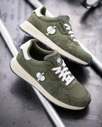 STRAUSS Canberra Steel Toe Work Shoe in Disguise green with workwear in a jobsite scene