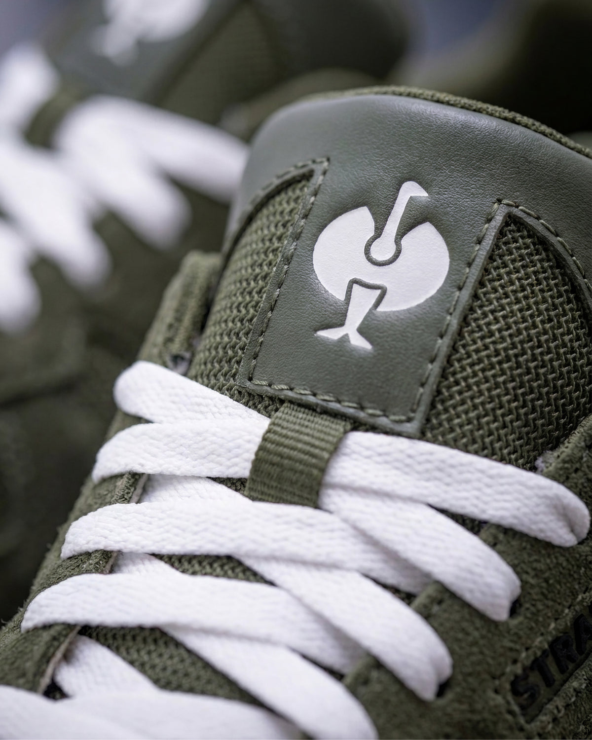 Close-up of the Disguise green Canberra Steel Toe Work Shoe laces