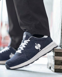STRAUSS Canberra Steel Toe Work Shoe in Nero blue worn in an outdoor work setting
