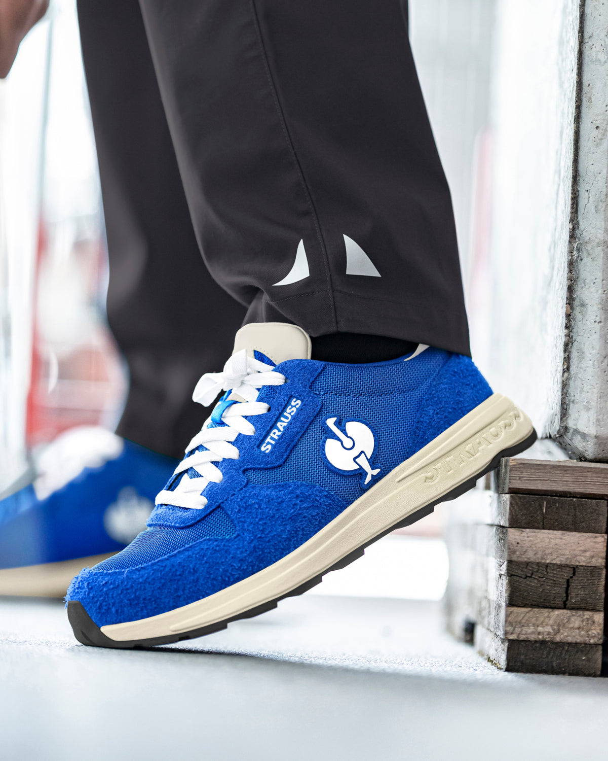 STRAUSS Canberra Steel Toe Work Shoe in Gentian blue shown on rough jobsite ground