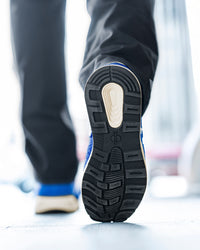STRAUSS Canberra Steel Toe Work Shoe in Gentian blue worn in an outdoor work setting