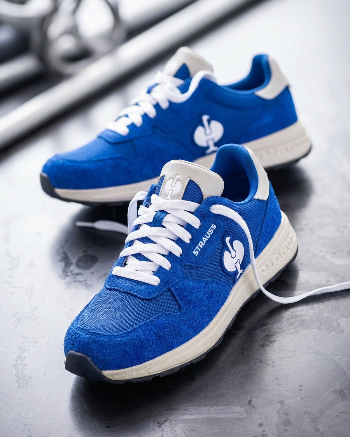 STRAUSS Canberra Steel Toe Work Shoe in Gentian blue with workwear in a jobsite scene