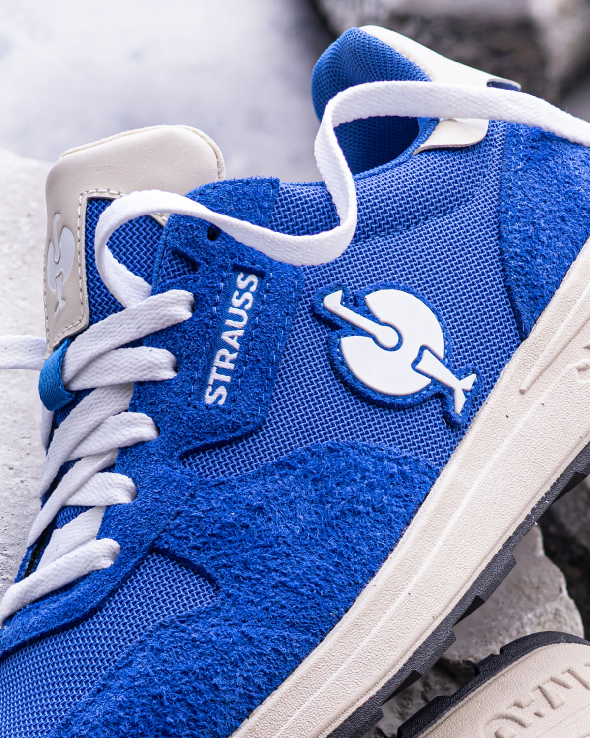 Close-up of the Gentian blue Canberra Steel Toe Work Shoe upper, laces, and steel toe area