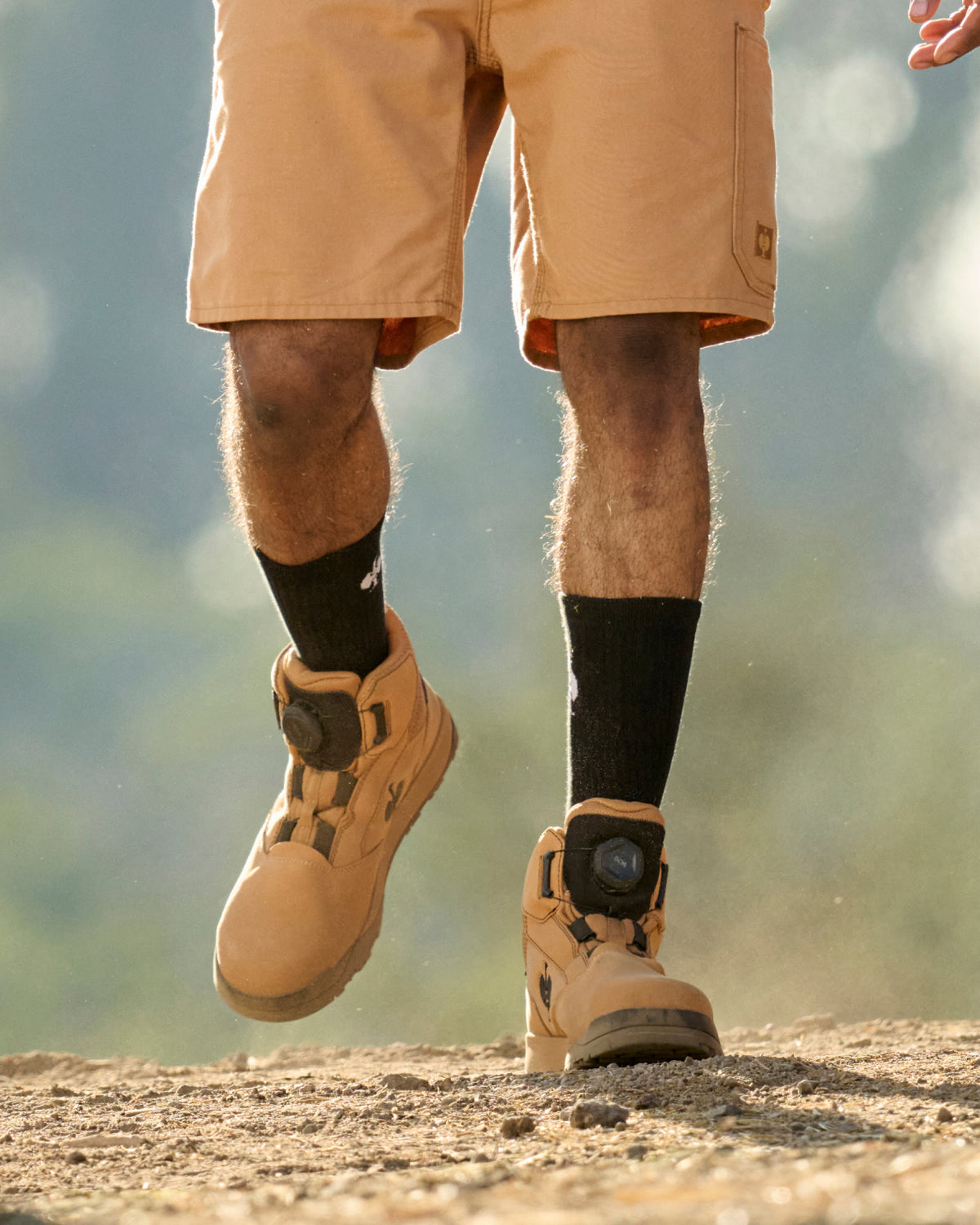 STRAUSS Murcia 6-inch Steel Toe Work Boot in Almond brown and Black worn in an outdoor work setting