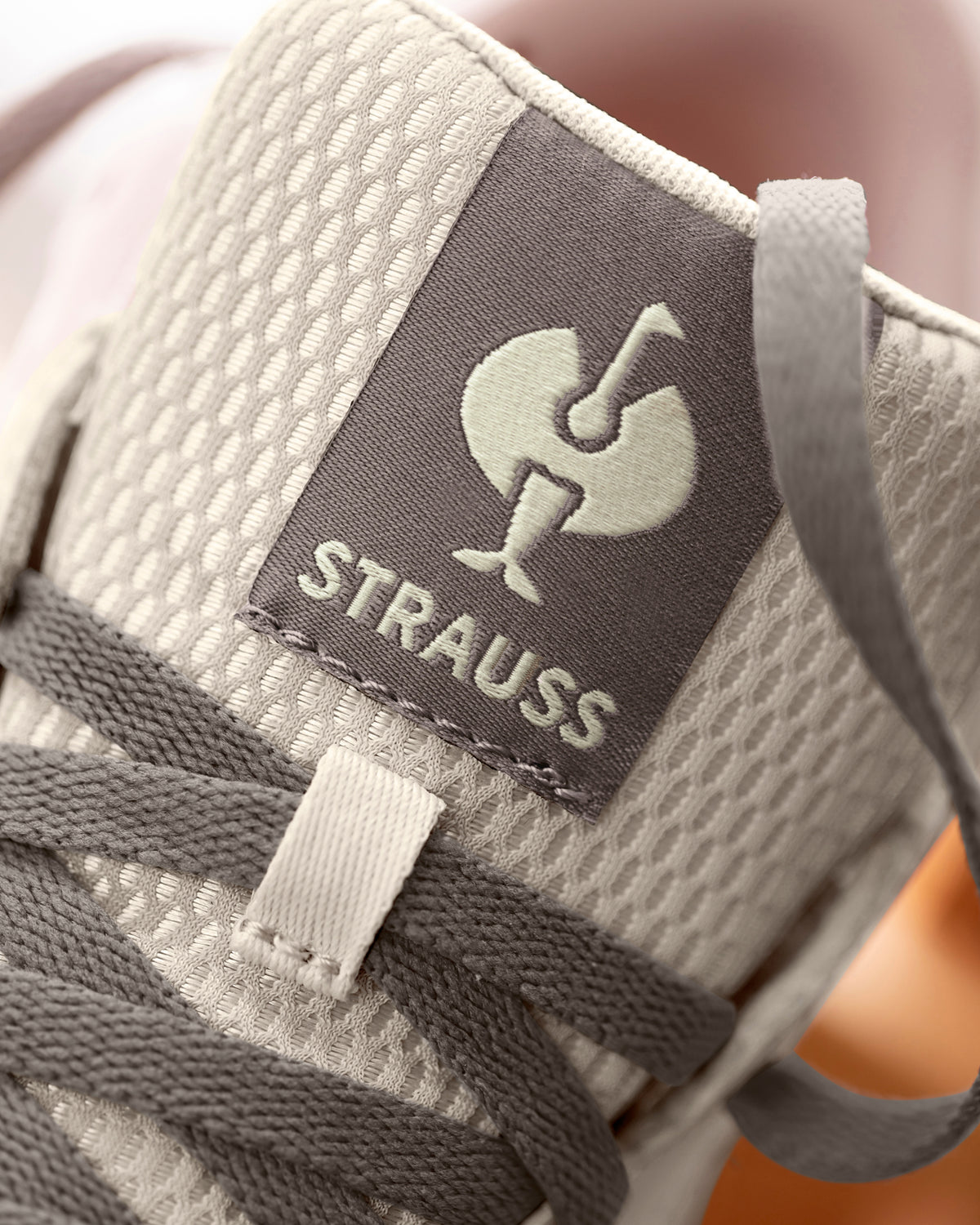 STRAUSS Eindhoven Steel Toe Work Shoe in Cream stone and Gray with workwear in a jobsite scene