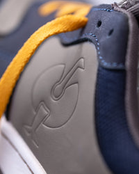 Close-up of the Nero blue and Stone gray Eindhoven Steel Toe Work Shoe upper
