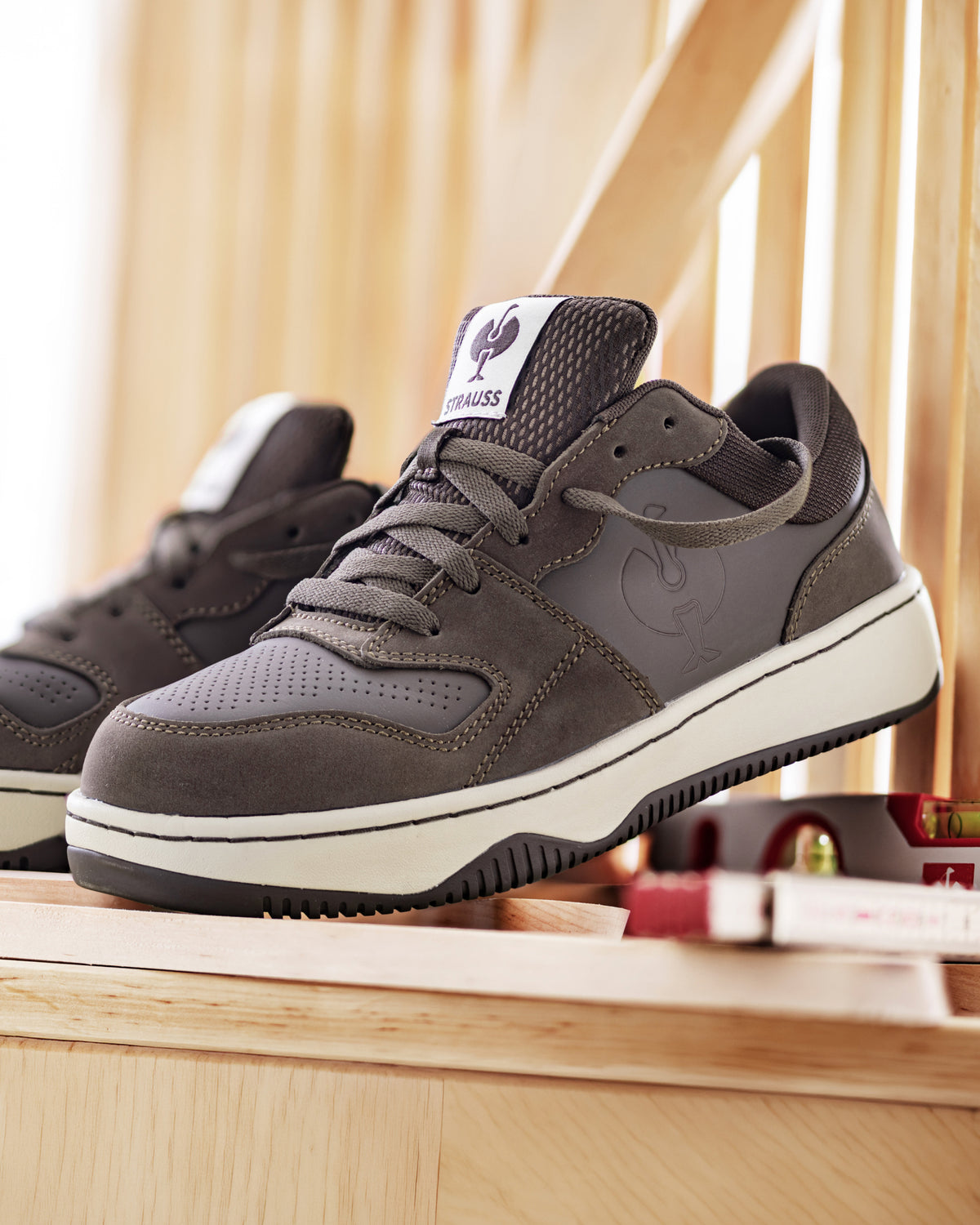 STRAUSS Eindhoven Steel Toe Work Shoe in Chestnut with workwear in a jobsite scene