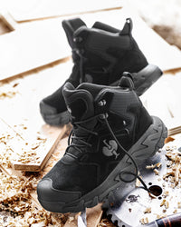 STRAUSS Turin 6-inch Aluminum Toe Work Boot in Black worn in an outdoor work setting