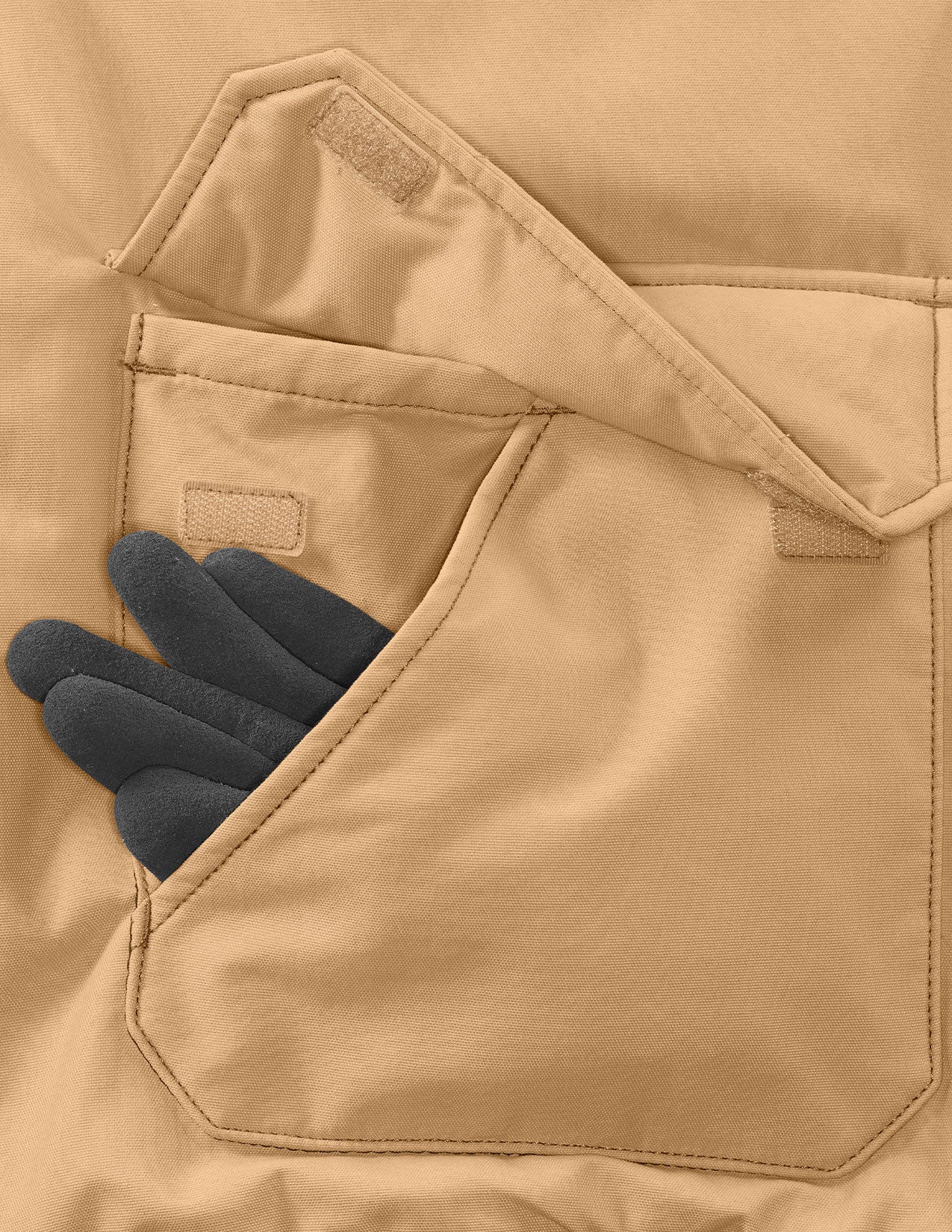 Close-up of a brown jacket pocket with a black glove partially inserted, on a matching beige background.