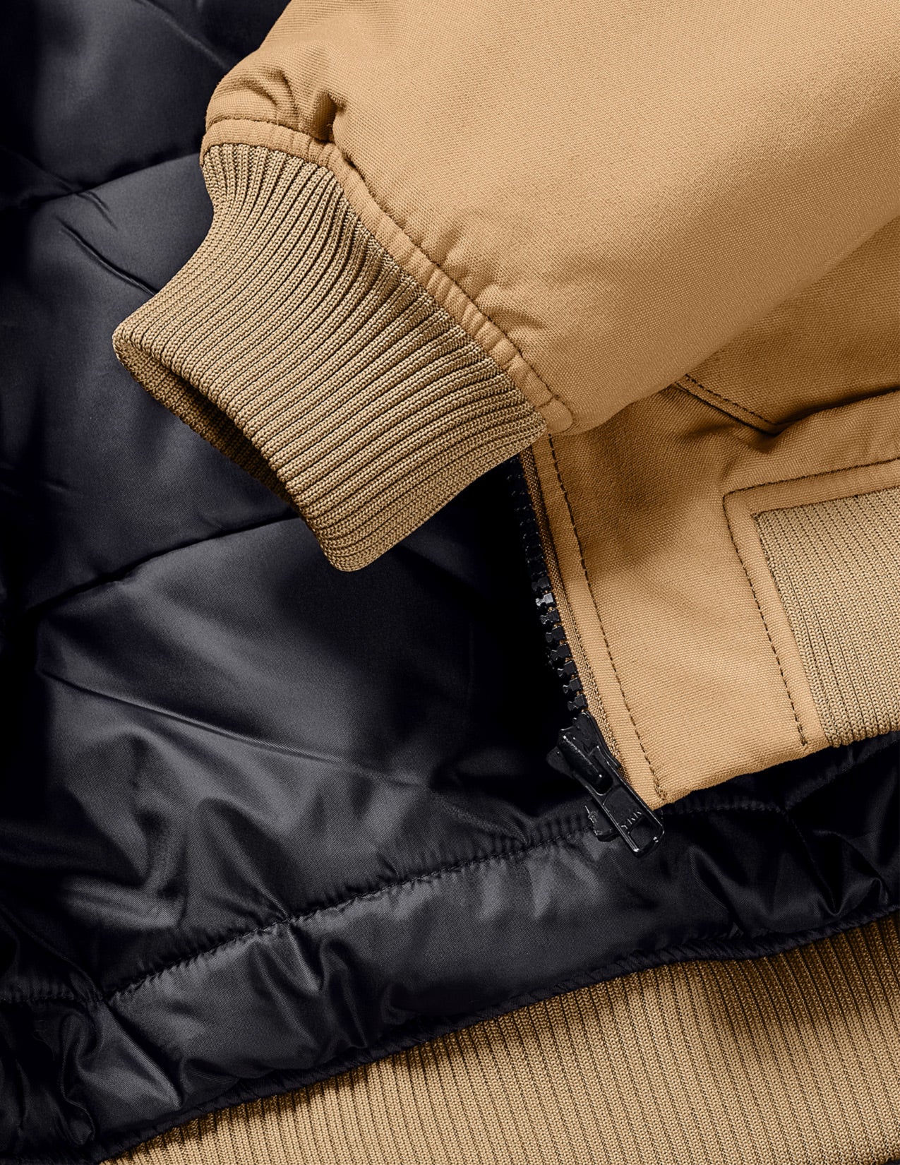 Close-up of a brown jacket with a focus on the collar and sleeve.