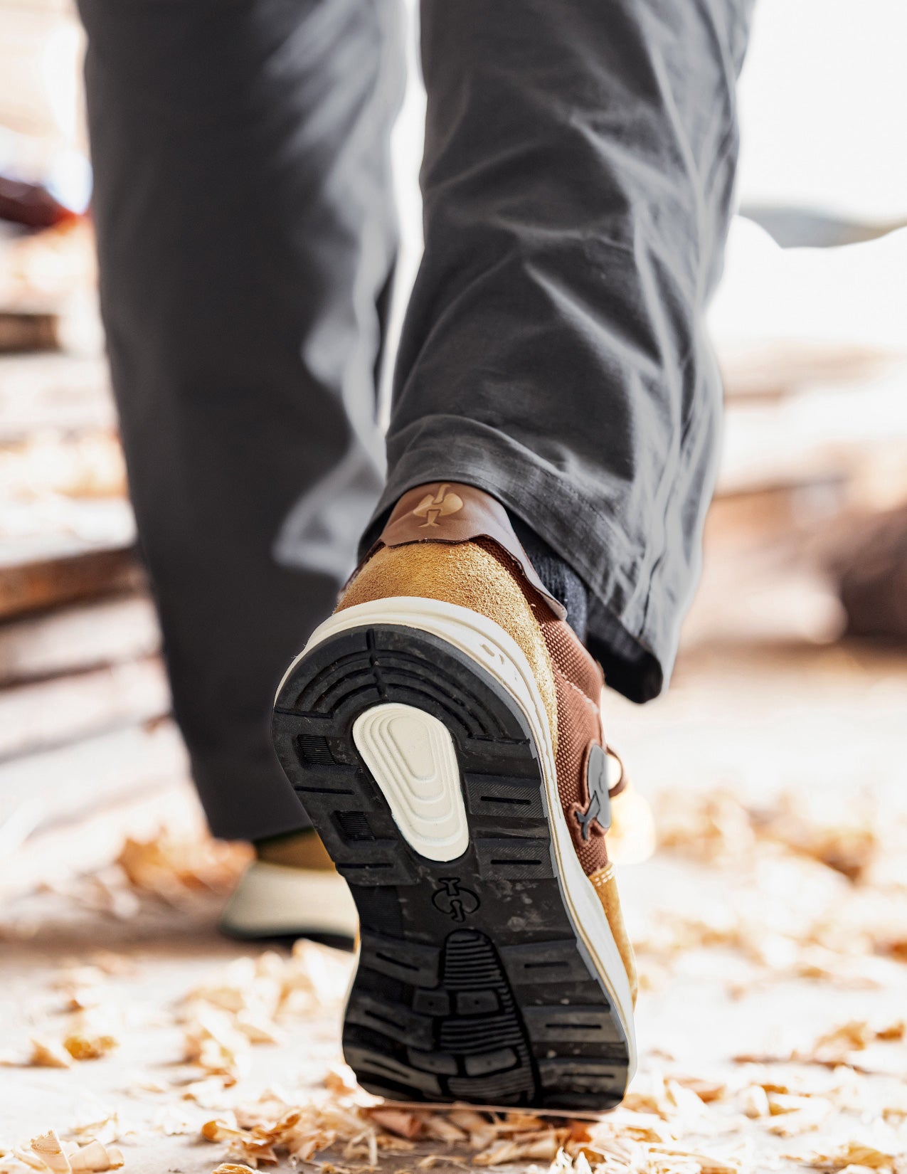 Brown shoe with a thick sole on a blurred natural background