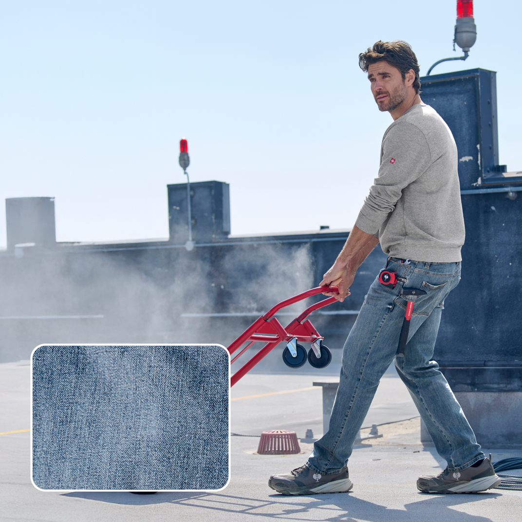 A man with a cart, with the denim fabric highlighted