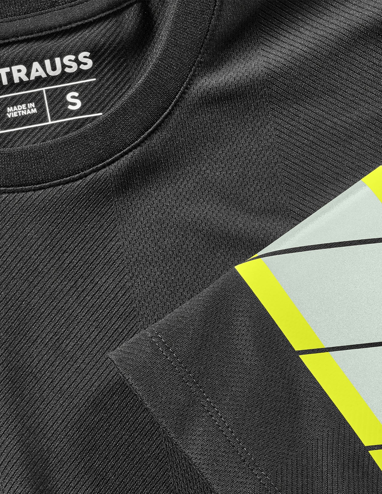 Black sports jersey with 'STRAUSS' branding and reflective material.
