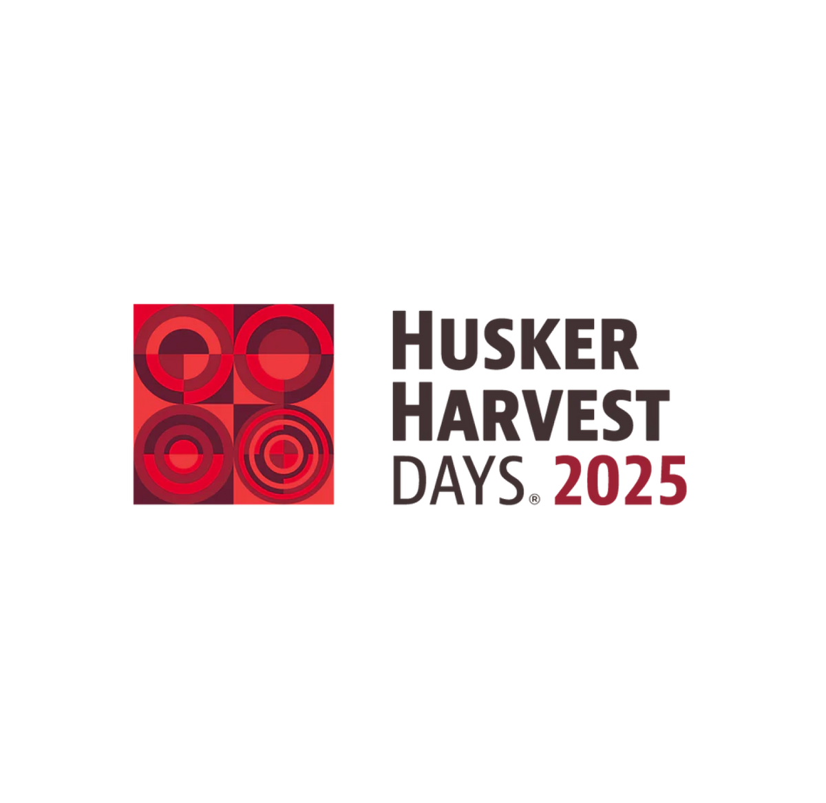 Husker Harvest Days 2025 logo with four red geometric circles on the left and event name in bold black and red text on the right.