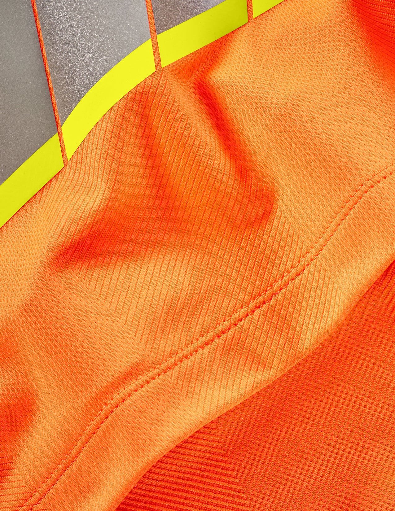 Close-up of orange fabric with a textured pattern