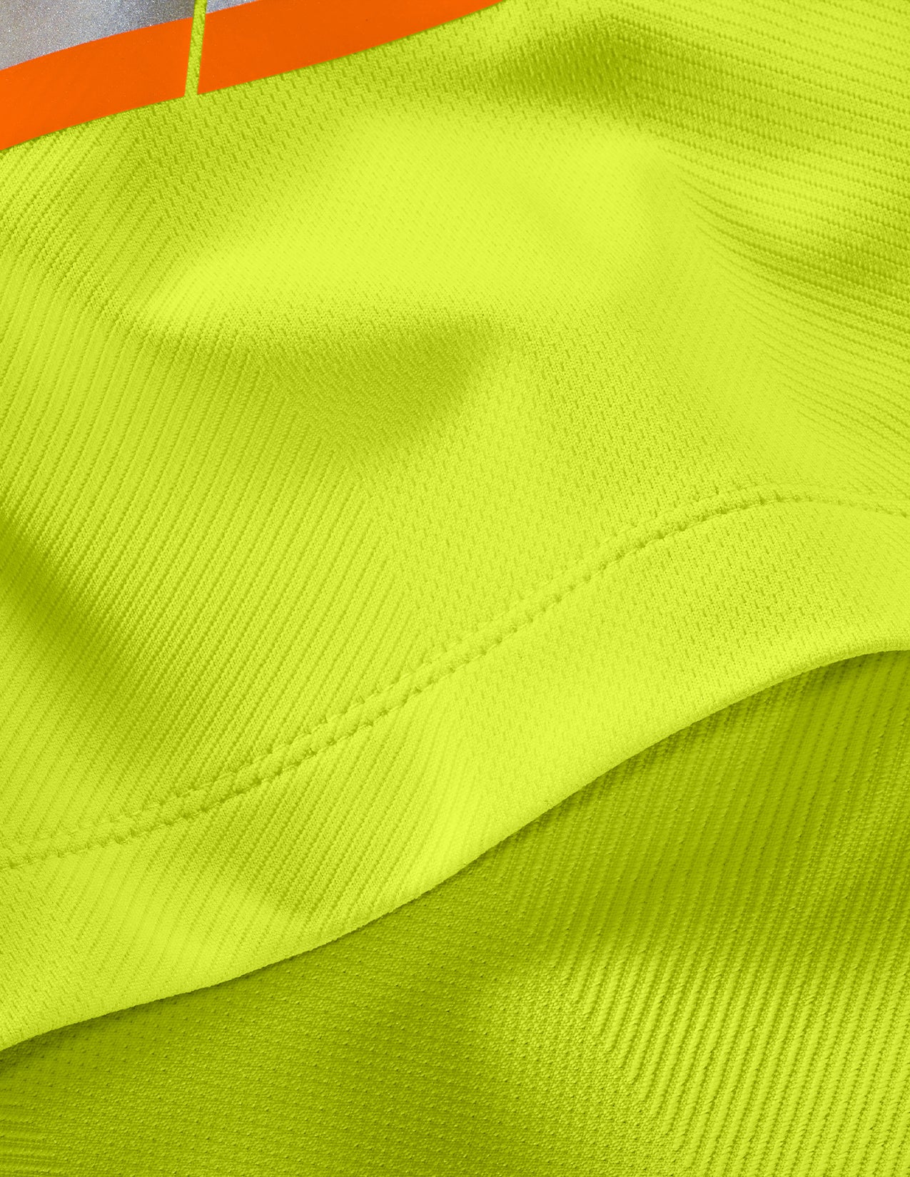 Close-up of a bright yellow fabric with an orange stripe.