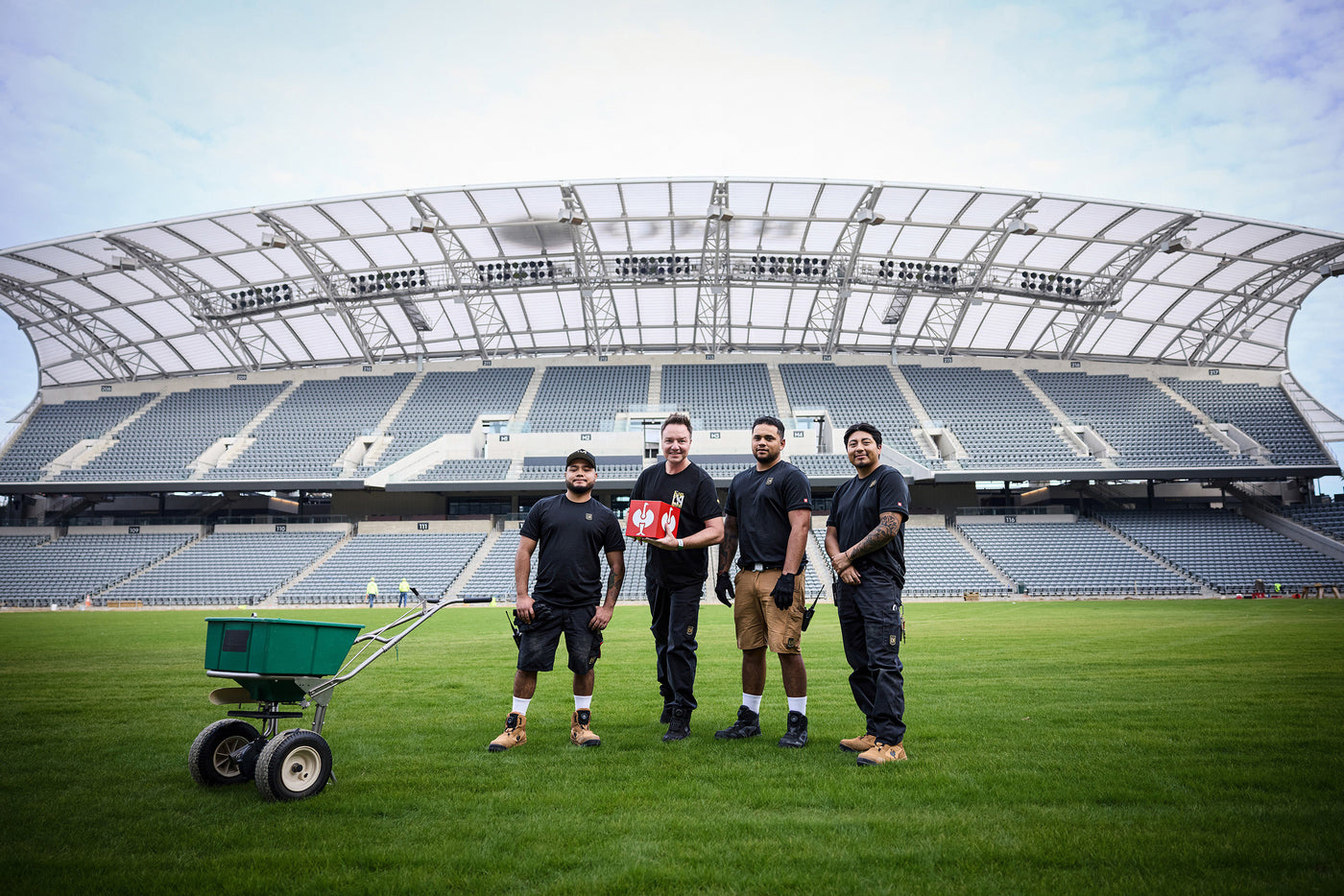 Henning Strauss and other people with lafc wear in front of the LAFC Stadium