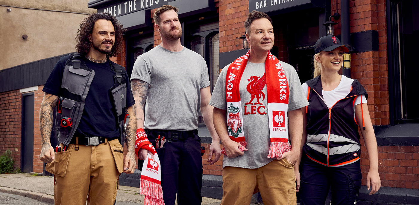 Henning Strauss with people wearing Strauss workwear and Liverpool fanwear