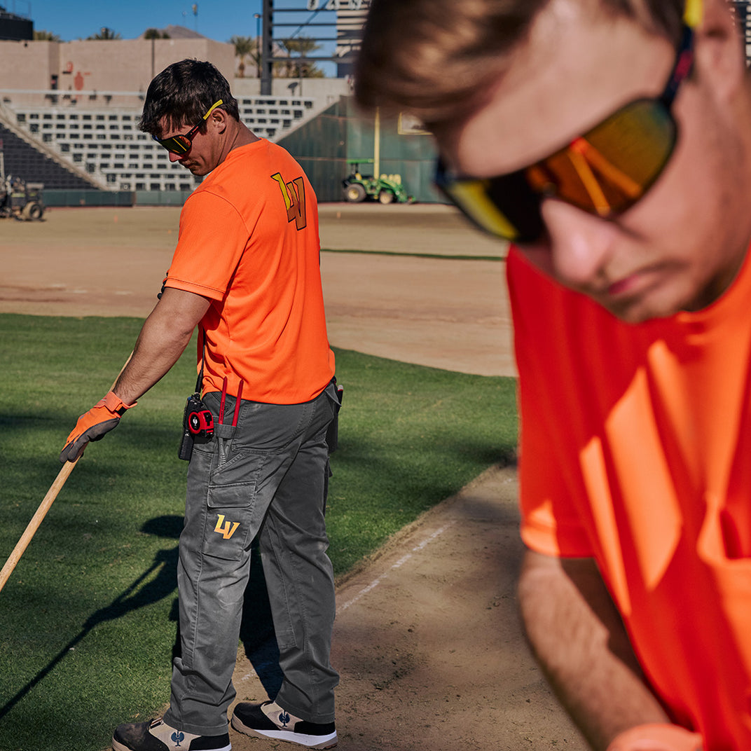 workers with strauss workwear in a baseball ballpark