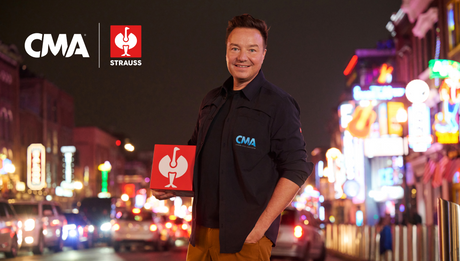 CEO Henning Strauss holding a red Strauss cube, standing in Nashville