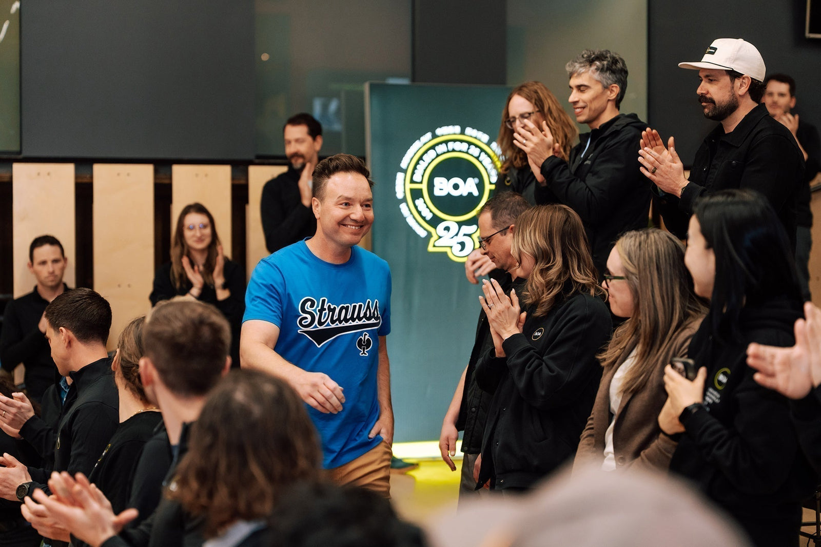 Henning Strauss walking through audience at award ceremony.