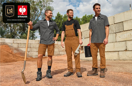 Three men stand on a jobsite in STRAUSS workwear. In the upper left corner is a LAFC x STRAUSS partner logo