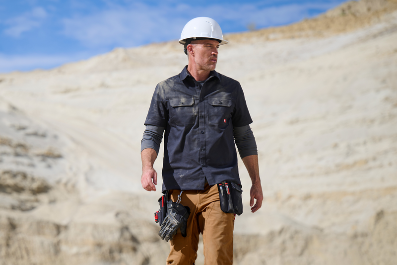 Man on a job site in a work shirt