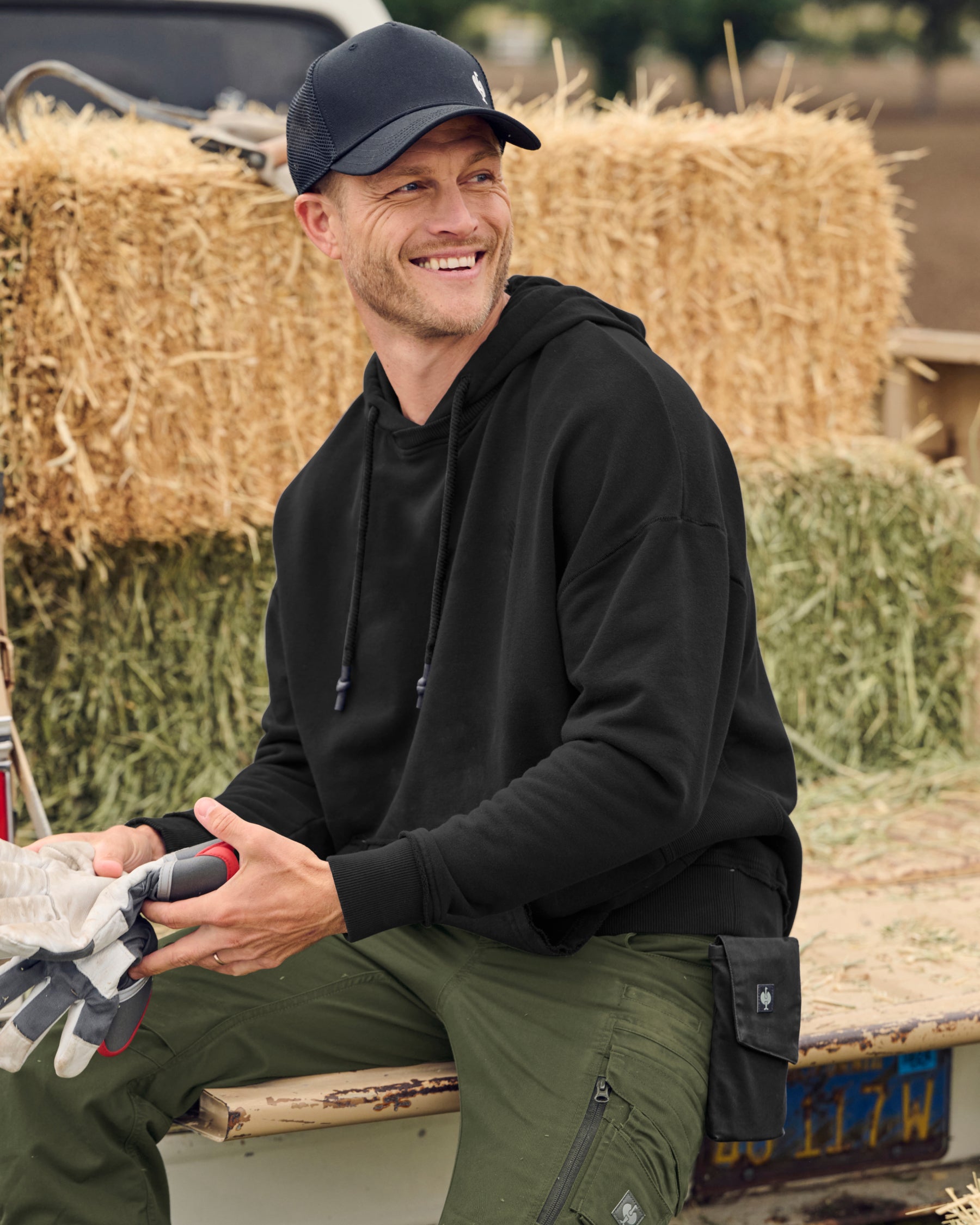 STRAUSS loose fit hoodie in black, worn in workwear outfit