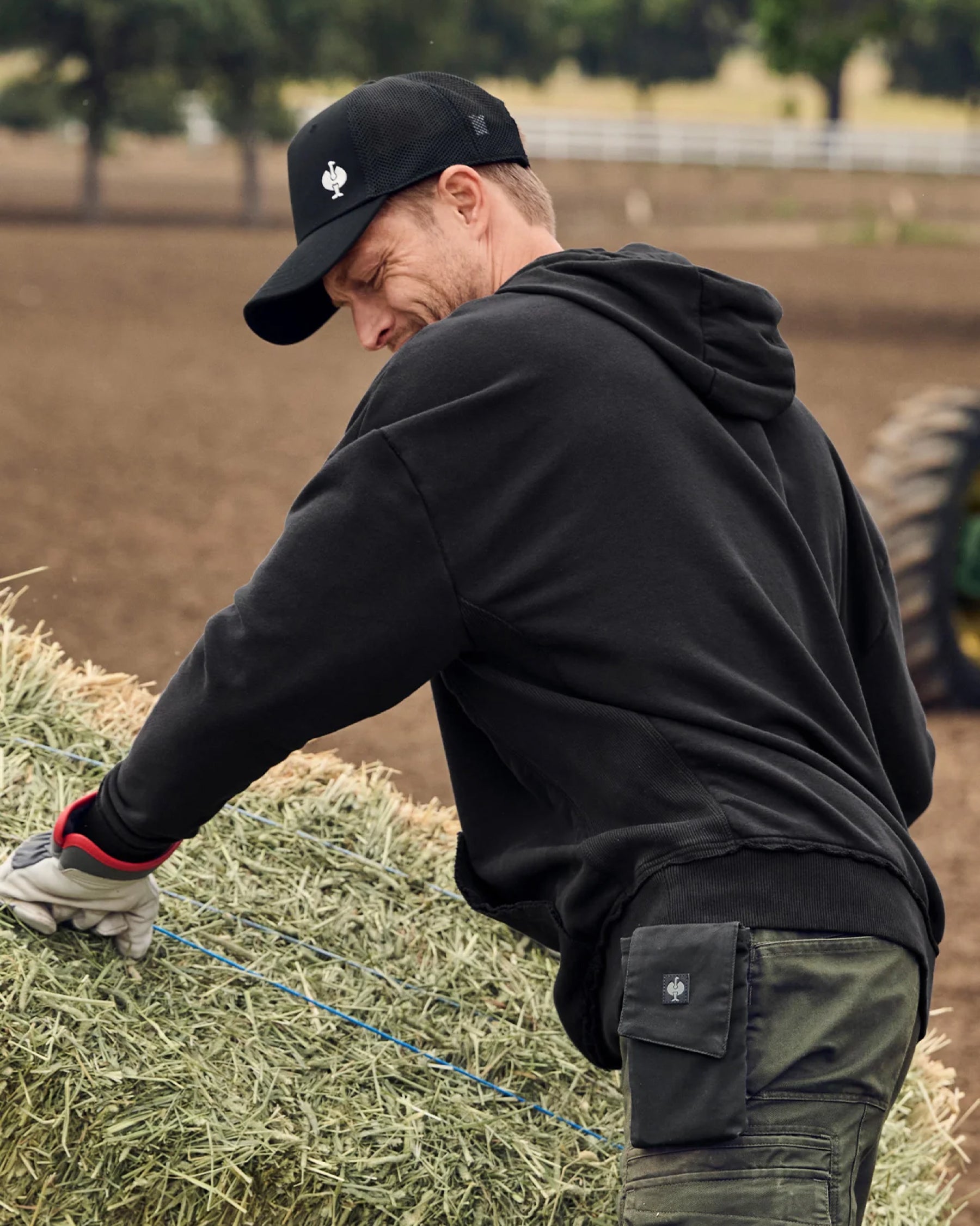 STRAUSS loose fit hoodie in black, worn in casual workwear setting