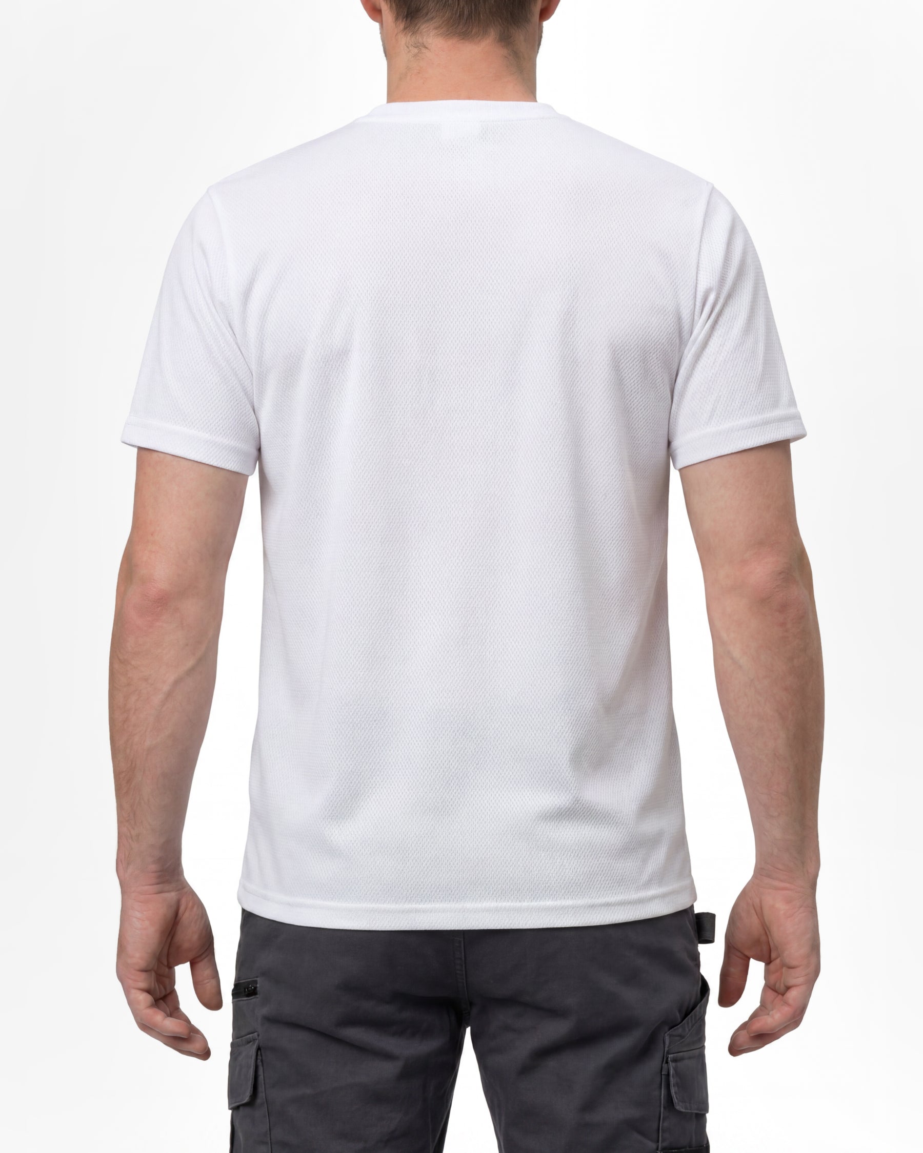 A model wears the STRAUSS Performance T-Shirt in white with tan work pants and work boots, showing the shirt fit