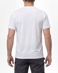 A model wears the STRAUSS Performance T-Shirt in white with tan work pants and work boots, showing the shirt fit