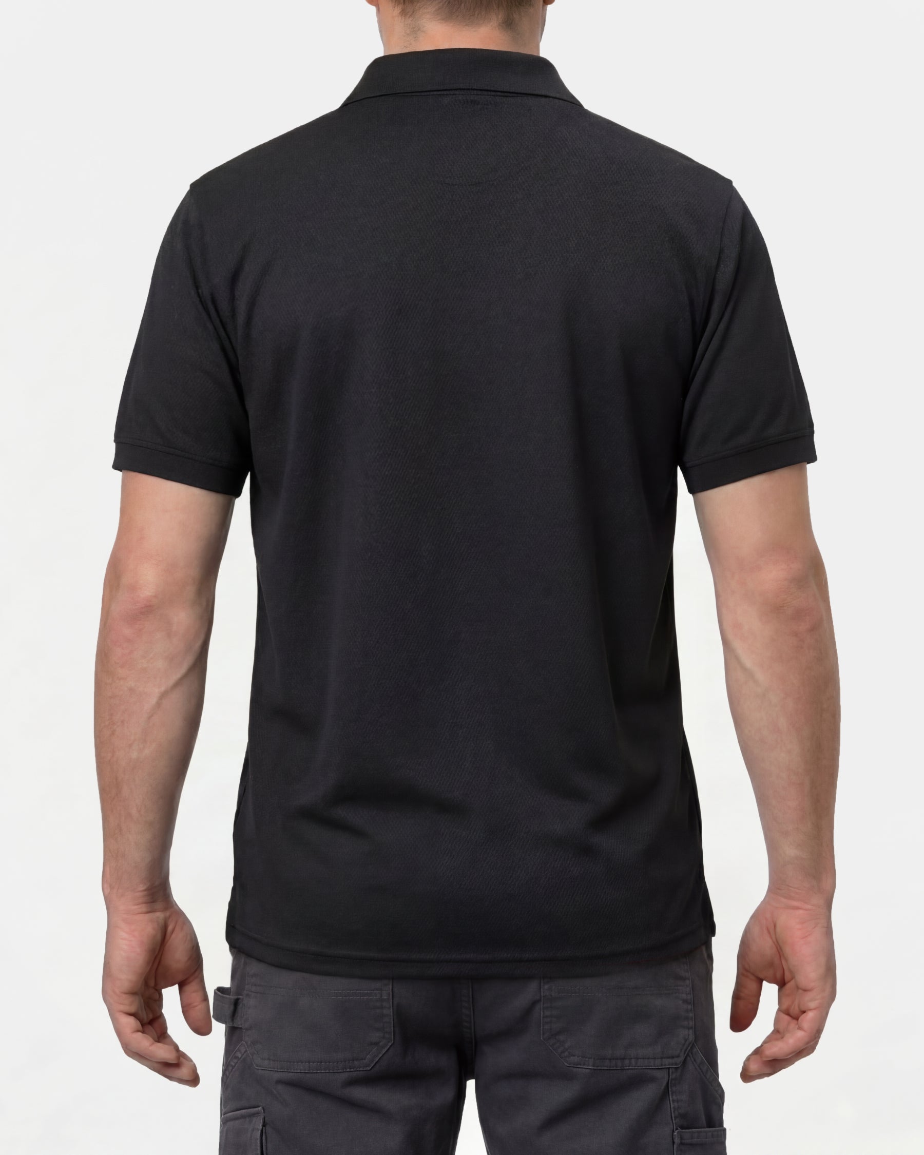 A model wears the STRAUSS Performance Polo Shirt in black