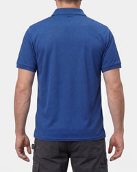 A model wears the STRAUSS Performance Polo Shirt in royal blue with tan work pants and work boots, showing the shirt fit