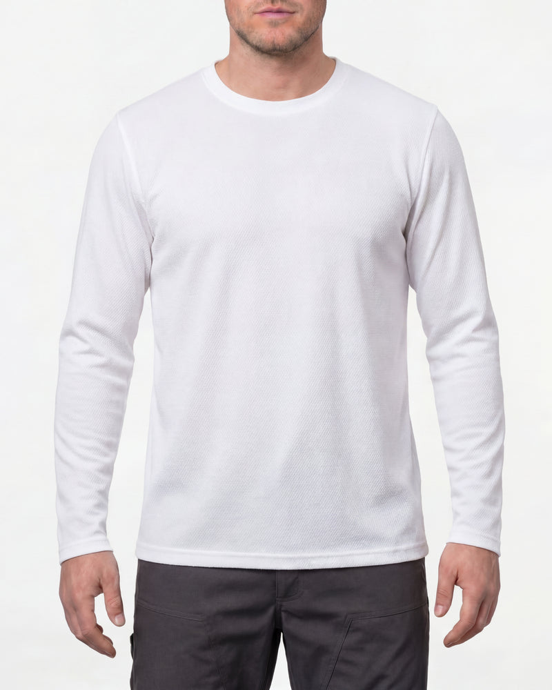 A model wears the STRAUSS Performance Long Sleeve Shirt in white in a studio product scene